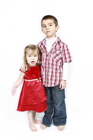 Adorable little brother and Sister on studio backgroundの写真素材