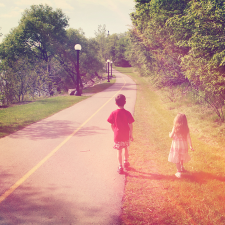 Adorable little brother and Sister on studio backgroundの写真素材
