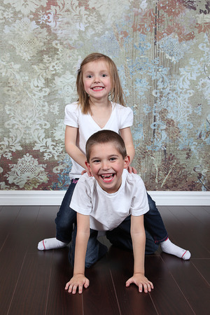 Adorable little brother and Sister on studio backgroundの写真素材