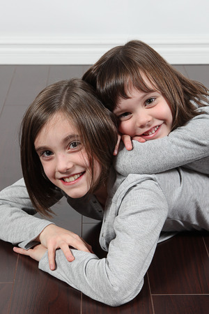 Adorable little girls posing for photosの写真素材