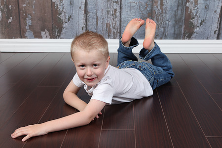Cute little boy posing for camera on white backgroundの写真素材