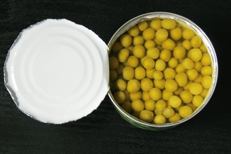 Canned peas on blackの写真素材