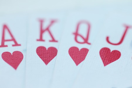 Playing cards with hearts close up macro photoの写真素材