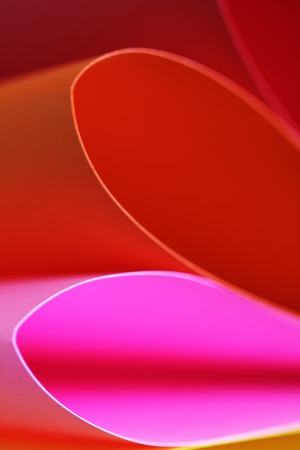 Abstract paper stack defocused colourful background. Paper stack of different colors defocusedの写真素材
