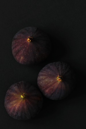 Fresh figs isolated on black beautiful food backgroundの写真素材