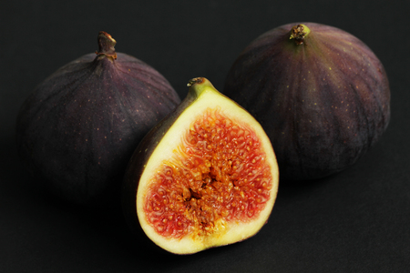 Fresh figs isolated on black beautiful food backgroundの写真素材
