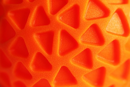 Orange rubber texture with triagle pattern close up brightの写真素材
