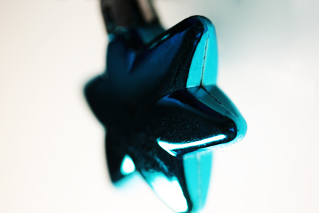 Blue chrismas ornament of star shape close up new year backgroundの写真素材