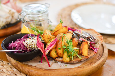 ried potatoes with fish and onions on a plateの写真素材