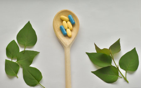 Apothecary of natural wellness and self-care. Herbs and medicine on white wooden background top view frame copy spaceの写真素材