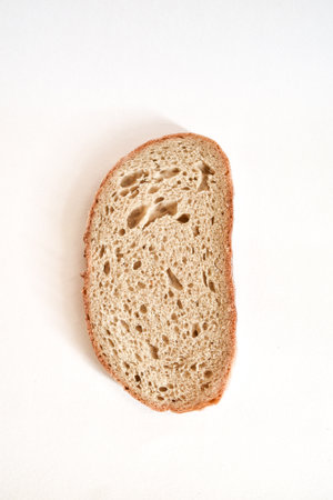 piece of bread vertically on a white background