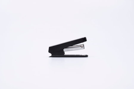 Black stapler on a white backgroundの写真素材