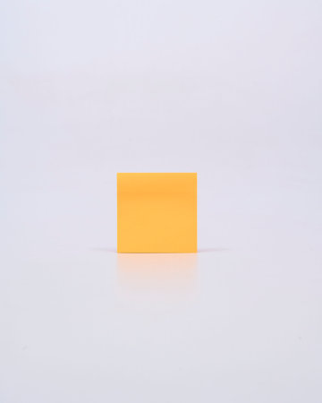sticky note, orange leaf, notepad on white backgroundの写真素材