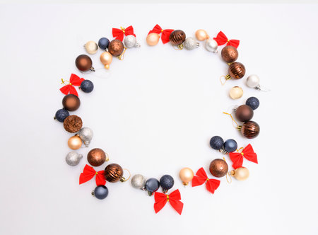 Christmas composition. Christmas gift, pine cones, fir tree branches on white background. Top view, flat lay, copy spaceの写真素材