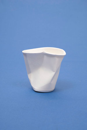 white paper cup on a blue backgroundの写真素材