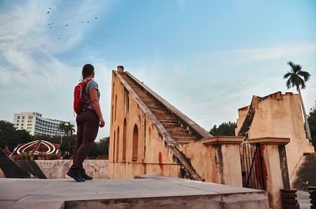 Girl tourist standing near Historic observatory, Jantar Mantar, New Delhi, Indiaの写真素材