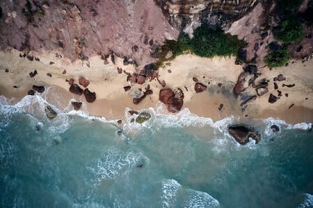 Aerial View of Waves and Azure beach with rocks. Kerala, India.の写真素材