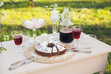 The cake strewed with icing sugar on a table. Freshly baked sweet cake. Festive breakfast. Breakfast...