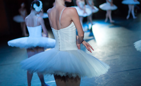 Ballet swan lake. Ballet statement. Ballerinas in the movement. Feet of ballerinas close up.の写真素材
