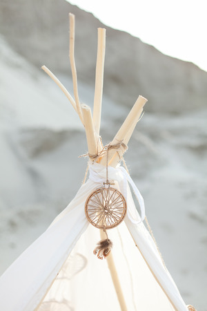 Indian tent. Dreamcatcher on white tent. Hunter of dreams. White tent.