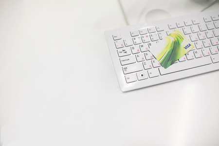 RUSSIA, MOSCOW - December 10, 2015: Photo of a VISA card on a white keyboard.のeditorial素材