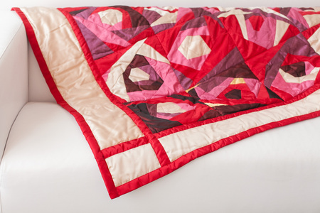 Patchwork quilt. Part of patchwork quilt as background. A blanket in style patchwork. Color blanket....