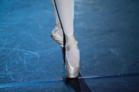 Ballet statement. Ballerinas in the movement. Feet of ballerinas close up.の写真素材