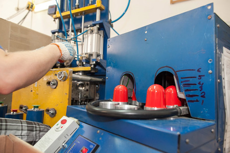 the machine on production of childrens toys. Plant on production of details of toys. Production of plastic details. Conveyor production.の写真素材