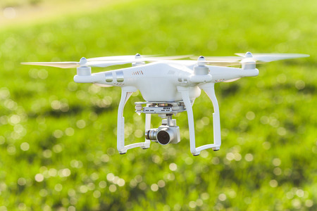 RUSSIA, ROSTOV-ON-DON - APRIL 20, 2017: quadrocopter on takeoff, low flying white drone with...