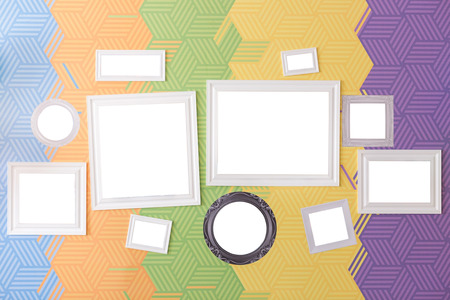 home decoration and art accessories concept - set of stylish picture frames of various sizes, square, round and rectangular, isolated on background with abstract pattern of five bright colorsの写真素材