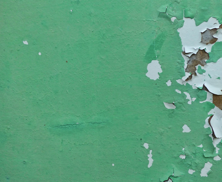 Surface painted green with cracksの写真素材