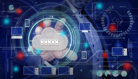Cloud computing. Businessman hand touching cloud with servers.