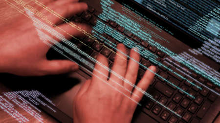 Programmer at work - software code running on screen and flying in the air.の写真素材