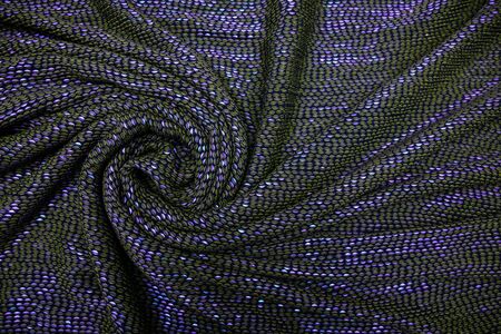 Blue fabric with colored beads spread out on the table. Materialの写真素材