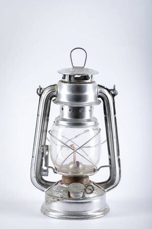 Silver kerosene lamp with wick  isolated on white background.の写真素材
