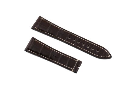 Dark brown, leather watchband white stitched at the edges, isolated on white background.の写真素材