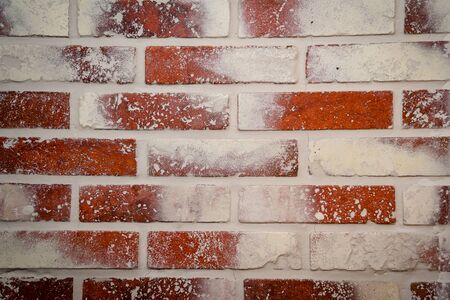 Red brick wall with white spots.の写真素材