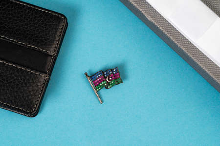 Azerbaijan flag lapel pin with purse on blue backgroundの写真素材