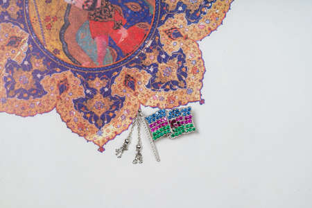 Azerbaijan silver flag lapel pin on ornament backgroundの写真素材