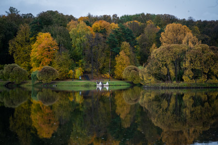 Autumn Reflections by the Lake with Colorful Treesの写真素材