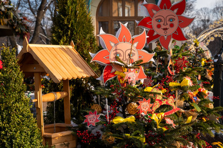 Festive Winter Decor with Sun Motif and Wooden Wellの写真素材