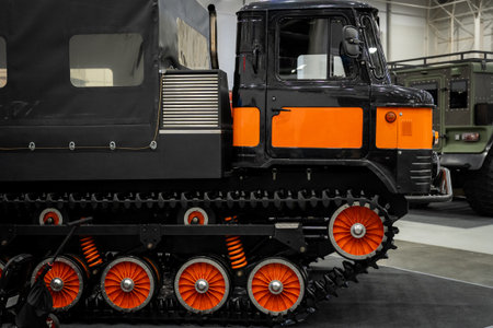 Close-Up of a Track Vehicle with Orange Detailing