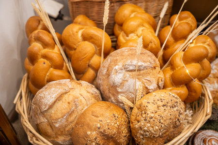 Variety of Fresh Artisan Breads in Wicker Basketの写真素材