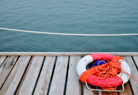 Red Lifebuoy in front of the blue sea