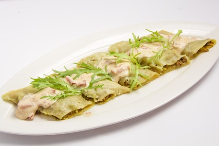 khinkali with meat and salad. On white backgroundの写真素材