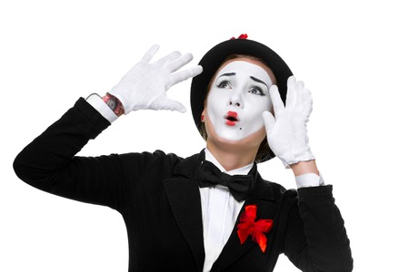 Portrait of the surprised and joyful woman as mime with open mouth isolated on white background.の写真素材