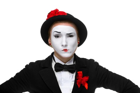 Portrait of the doubting woman as mime with dissatisfaction with a grimace on his face isolated on white background. の写真素材