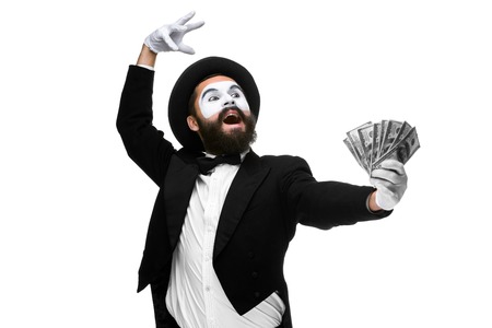 Man with a face mime dancing with money isolated on a white background. concept concept love of money, happiness from money luckの写真素材