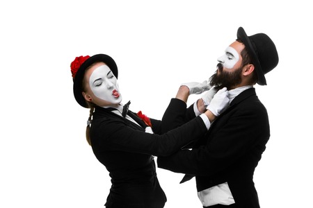 Two memes as businessmen fighting for being the boss, isolated on a white background. concept  of struggle for powerの写真素材