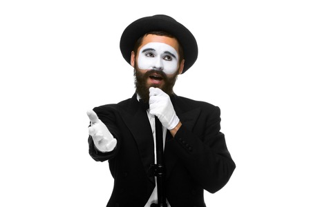portrait of a man as mime with tube or retro style microphone isolated on whiteの写真素材